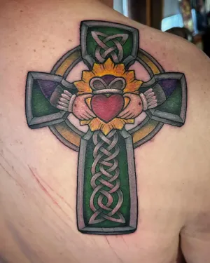 Colour Celtic cross with a Claddagh heart and hands on a shoulder — by Adam Crane