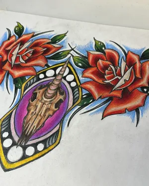 Neo-traditional flash of two red roses framing an ornate gold locket — by Adam Crane