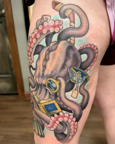 Colour octopus clutching cut gemstones, tattooed on a thigh — by Adam Crane at Ministry Ink