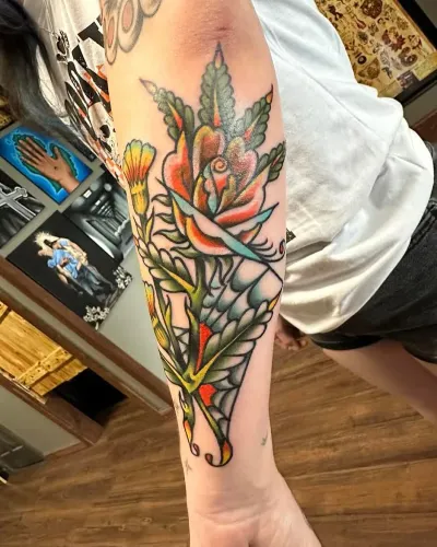 American traditional torch and foliage forearm piece in colour — by Chay Menke at Ministry Ink