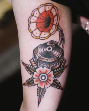 American traditional pocket watch and flowers on an arm — by Chay Menke
