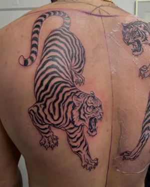 Black and grey tiger back piece, healed and settled — by Gabriel Gonzalez
