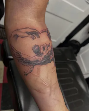 Fine line dragon curling around a forearm — by Gabriel Gonzalez